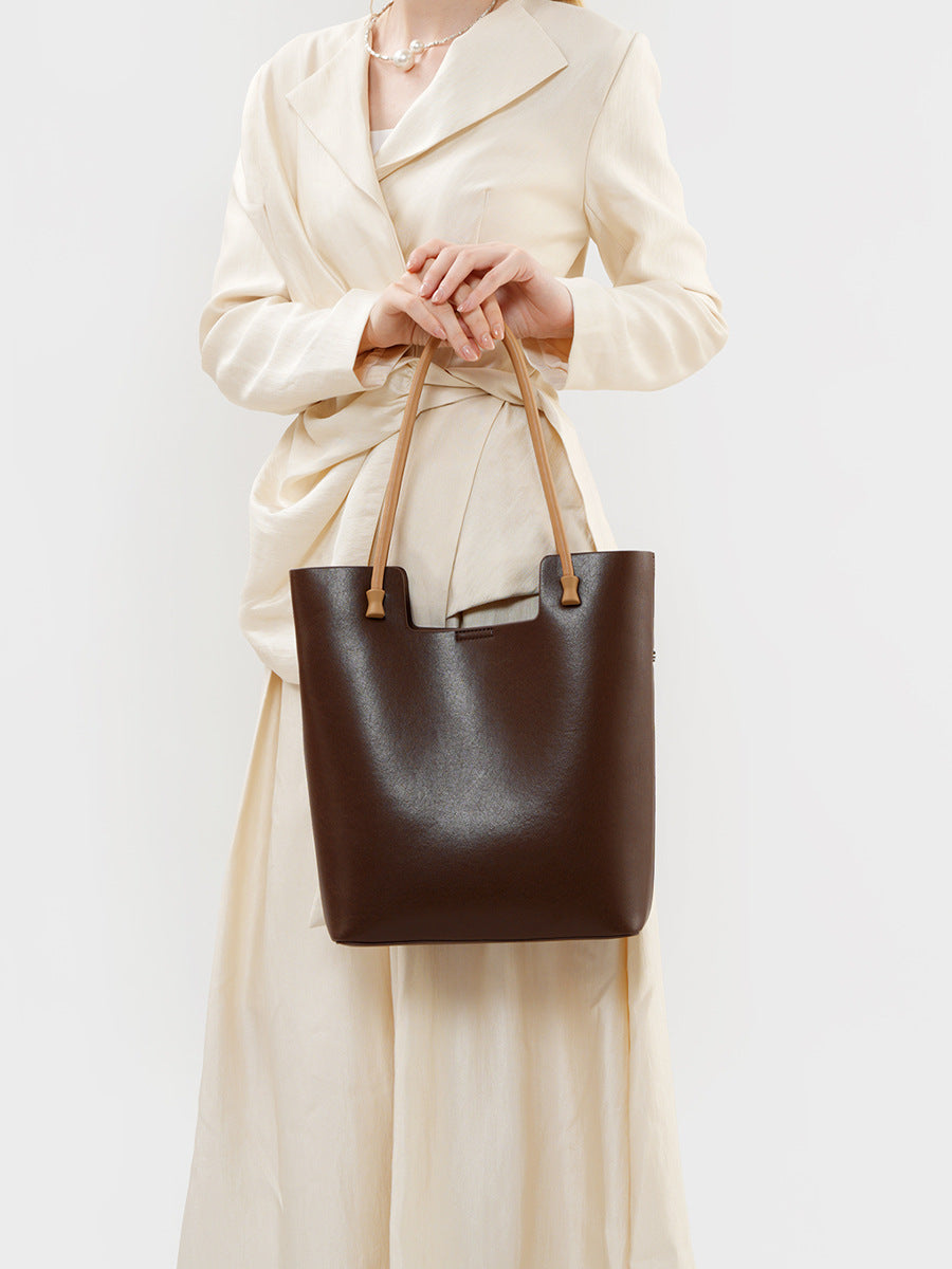 The Liora Leather Tote in Coffee — styled view